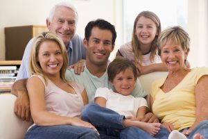 Extended family in living room smiling